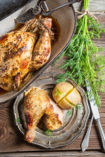 Roasted chicken and jacket potato with dill — Stock Photo, Image