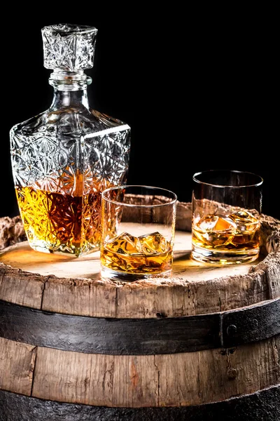 Two glassed of aged brandy or whiskey on the rocks — Stock Photo, Image