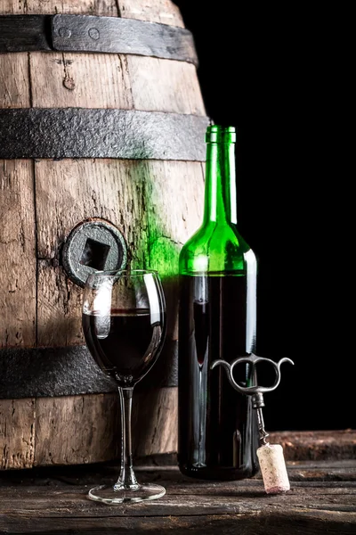 Glass of wine and bottle in the old cellar — Stock Photo, Image