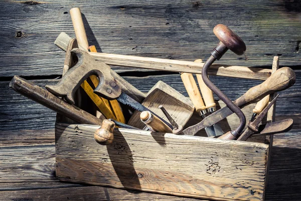 Old wooden carpenters box with tools — Stock Photo, Image