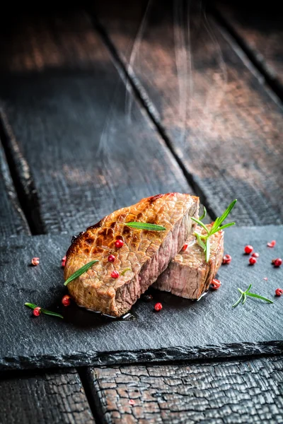 Hot grilled meat with fresh rosemary — Stock Photo, Image