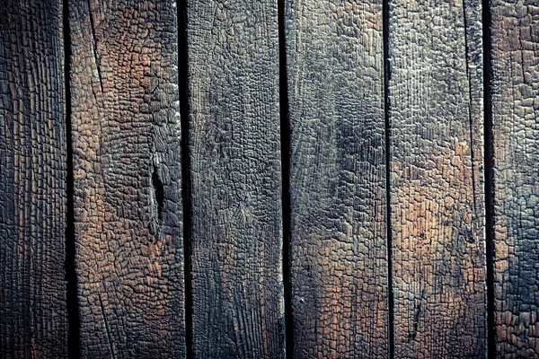 Black burnt wooden fence — Stock Photo, Image