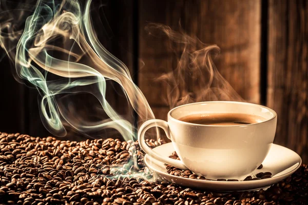 Smaak koffie beker met geroosterde zaden — Stockfoto