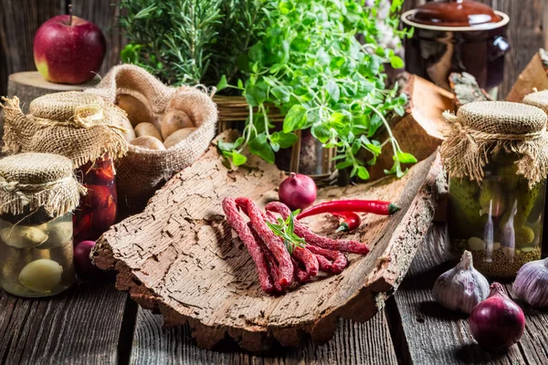 Homemade thin sausages in cellar — Stock Photo, Image