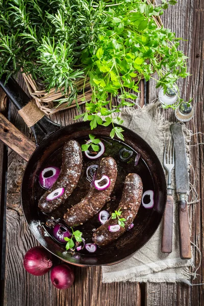 Hot black pudding on pan — Stock Photo, Image