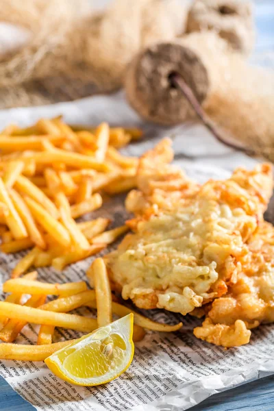 Fresh fish cod with chips served in paper — Stock Photo, Image