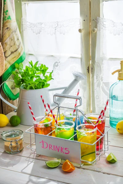 Cold drink with straw and fruits — Stock Photo, Image