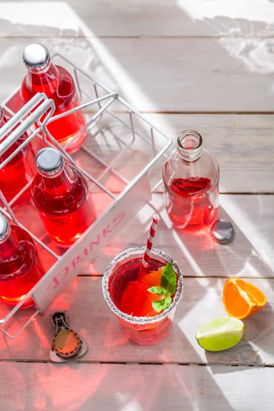 Cold summer drink in bottle with mint leaf — Stock Photo, Image