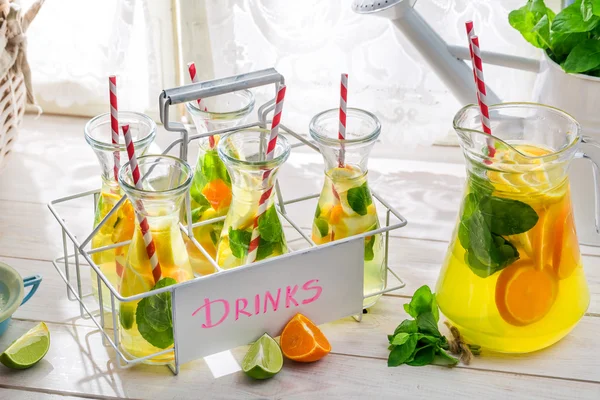 Summer lemonade with straw and fruits — Stock Photo, Image