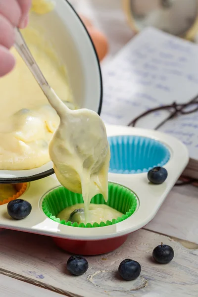 Preparation for tasty muffins with blueberries — Stock Photo, Image