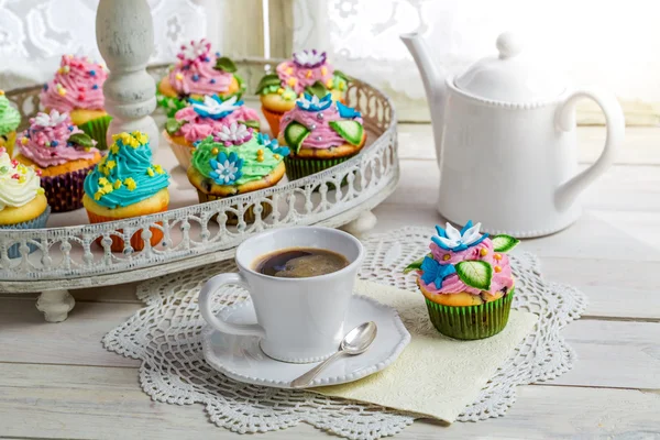 Fresh muffins with sweet decoration and coffee — Stock Photo, Image