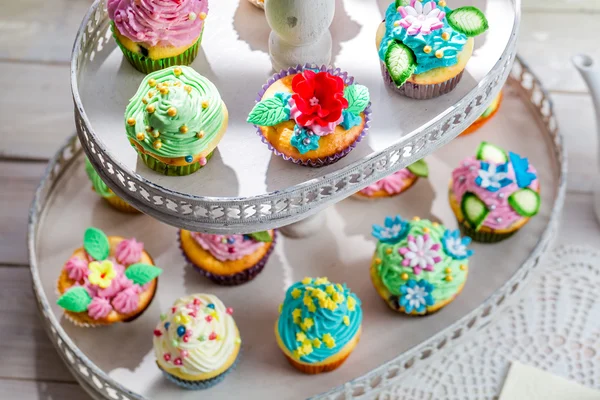 Tasty muffins with sweet decoration — Stock Photo, Image