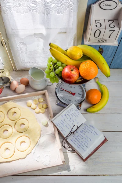 Preparation for sweet donuts in the sunny kitchen — Stock Photo, Image