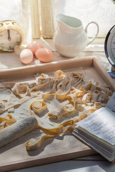 Homemade tagliatelle in the sunny kitchen — Stock Photo, Image