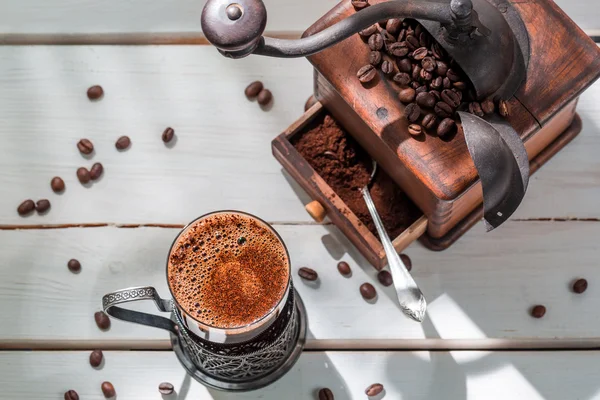 Freshly roasted ground coffee with beans — Stock Photo, Image