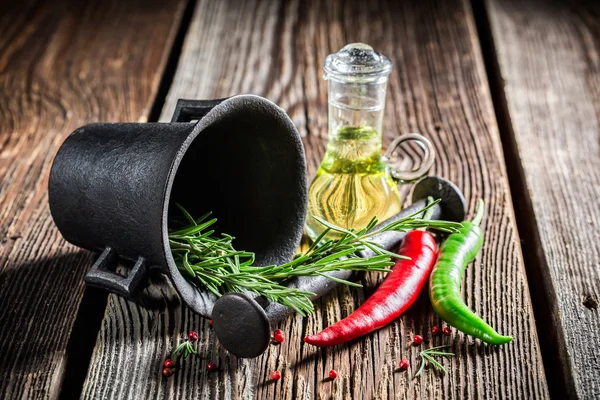 Mortar with fresh spices and herbs — Stock Photo, Image