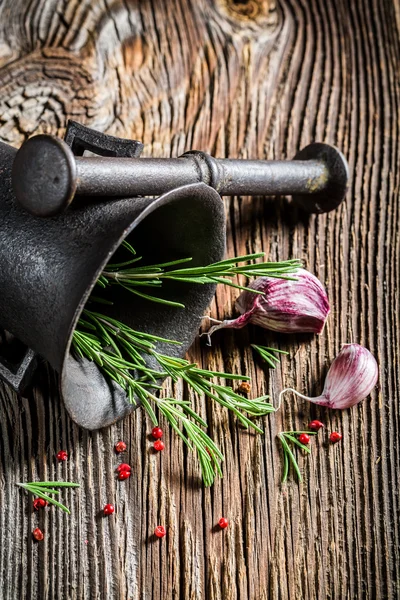 Mortar with tasty herbs and spices — Stock Photo, Image