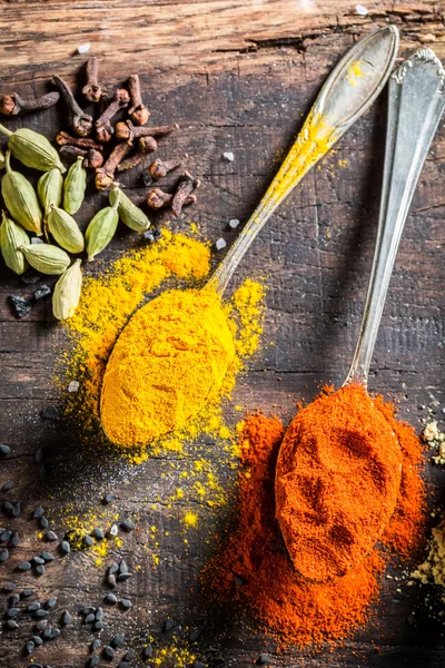 Colorful condiments on old table — Stock Fotó