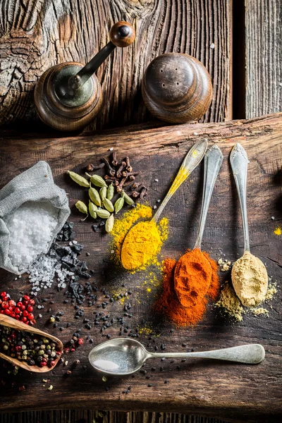 Fresh spices and herbs on old board — Stock Fotó