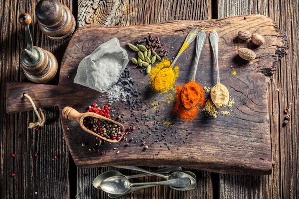 Fresh spices and herbs on old table — Stock Photo, Image