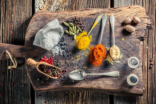 Various herbs and spices on old table — Stock Fotó
