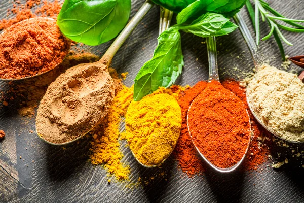 Intensive condiments on old table — Stock Fotó