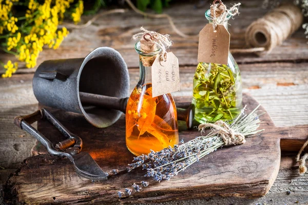 Homemade herbs in bottles as natural medicine — Stock Photo, Image