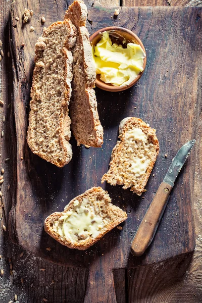 Tasty loaf of bread with whole grains for breakfast — Stock Photo, Image