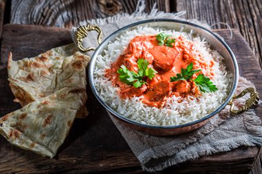 Indian tikka masala with chicken in tomato sauce clipart