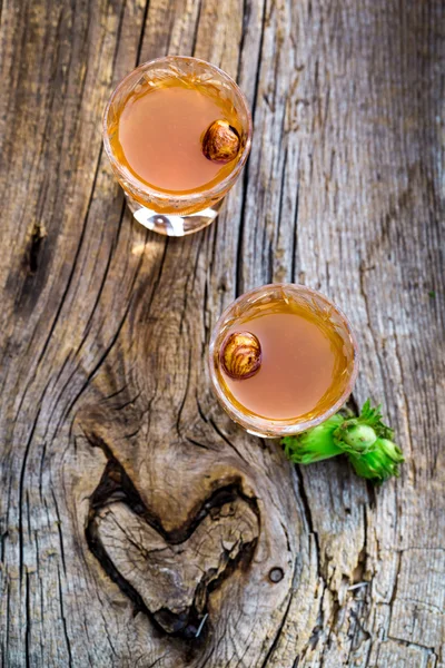 Homemade liqueur with alcohol and nuts — Stock Photo, Image