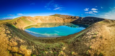 Panorama of blue lake in the crater of a volcano in Iceland clipart