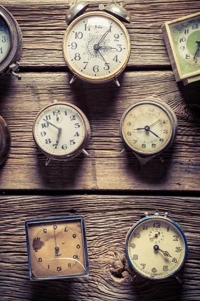 Aged wall with clocks — Stock Photo, Image