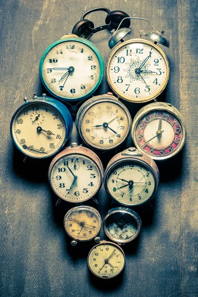 Old clocks in pile