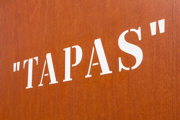 Tapas letters on a wall — Stock Photo, Image