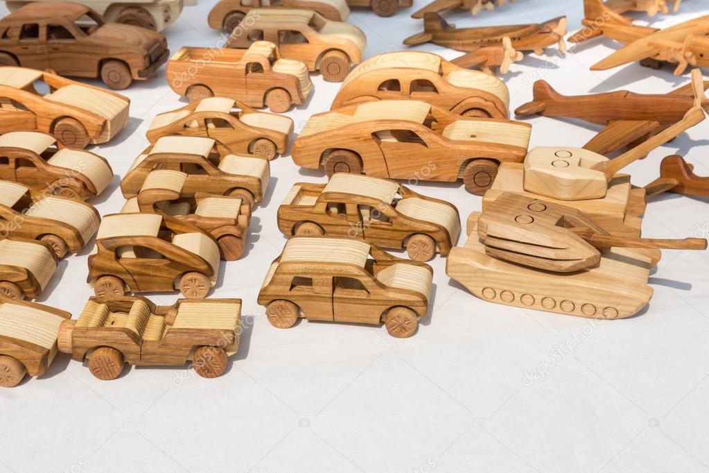 Wooden toy cars, tanks, and plans