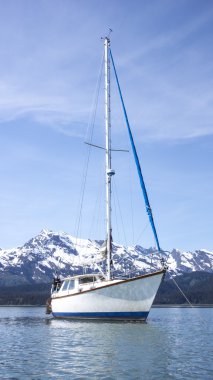 Alaskan sailboat at anchor clipart