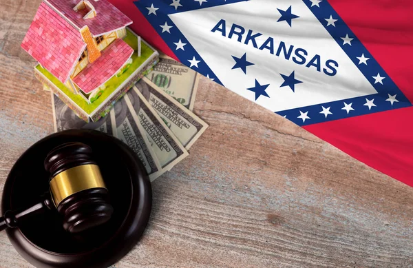 Property auction, flag Arkansas, gavel wooden and model house on wooden background, lawyer of home real estate