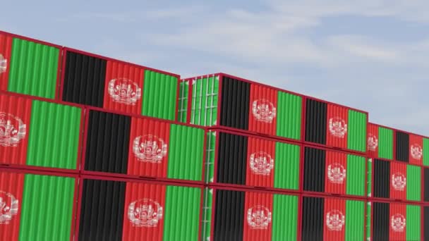 Afghanistan flag containers are located at the container terminal. Concept for Afghanistan import and export of closed-loop 3D animation