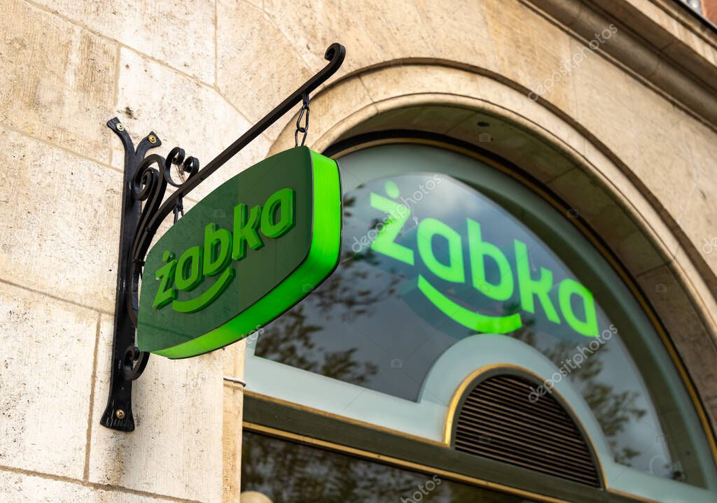 A picture of the Zabka logo on display in front of one of the shops.