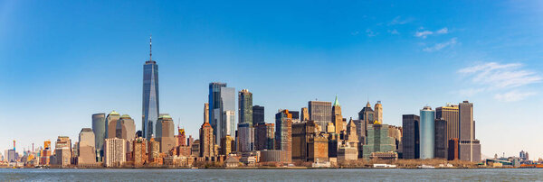 A panorama picture of the buildings at Lower Manhattan towered by the One World Trade Center.