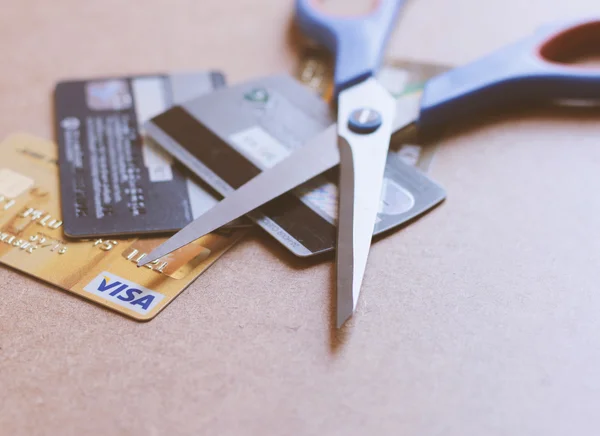 Scissors on various of credit cards — Stock Photo, Image