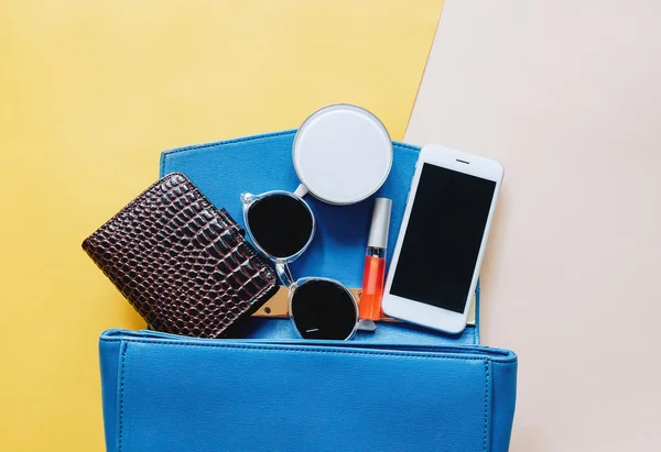 Woman bag open out with cosmetics — Stock Photo, Image