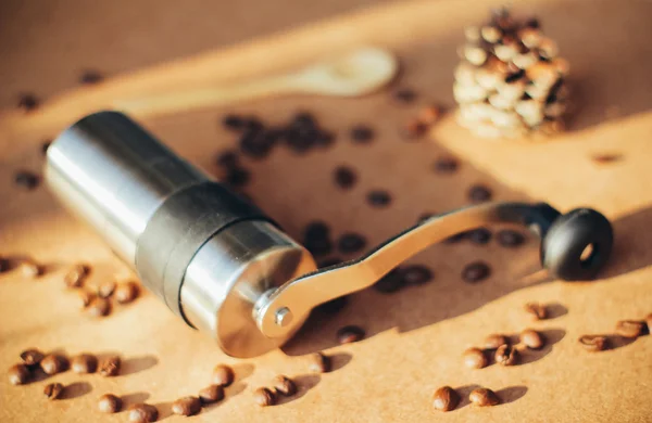 Coffee grinder and spoon — Stock Photo, Image