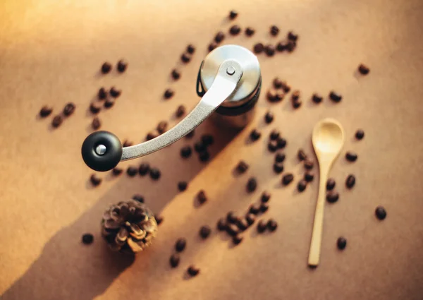 Coffee grinder and spoon — Stock Photo, Image