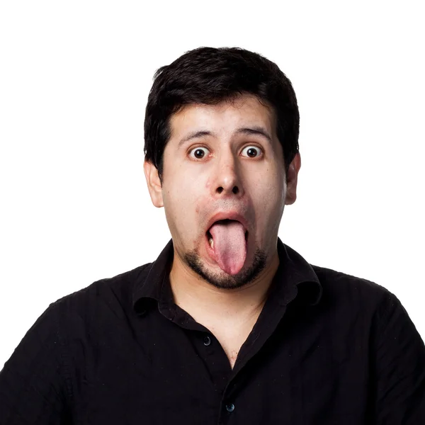 Hombre hispano sacando la lengua — Foto de Stock