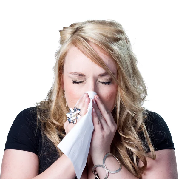 Mujer joven estornudando —  Fotos de Stock