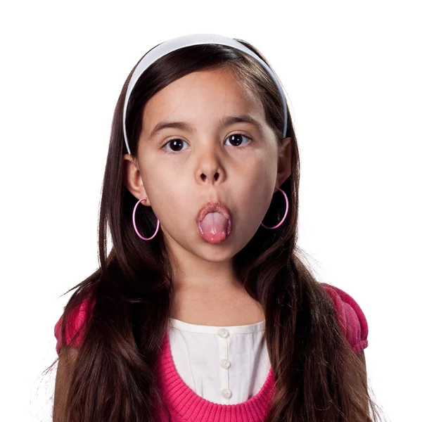 Girl being stuborn and sticking her tongue out - Stock Image. 