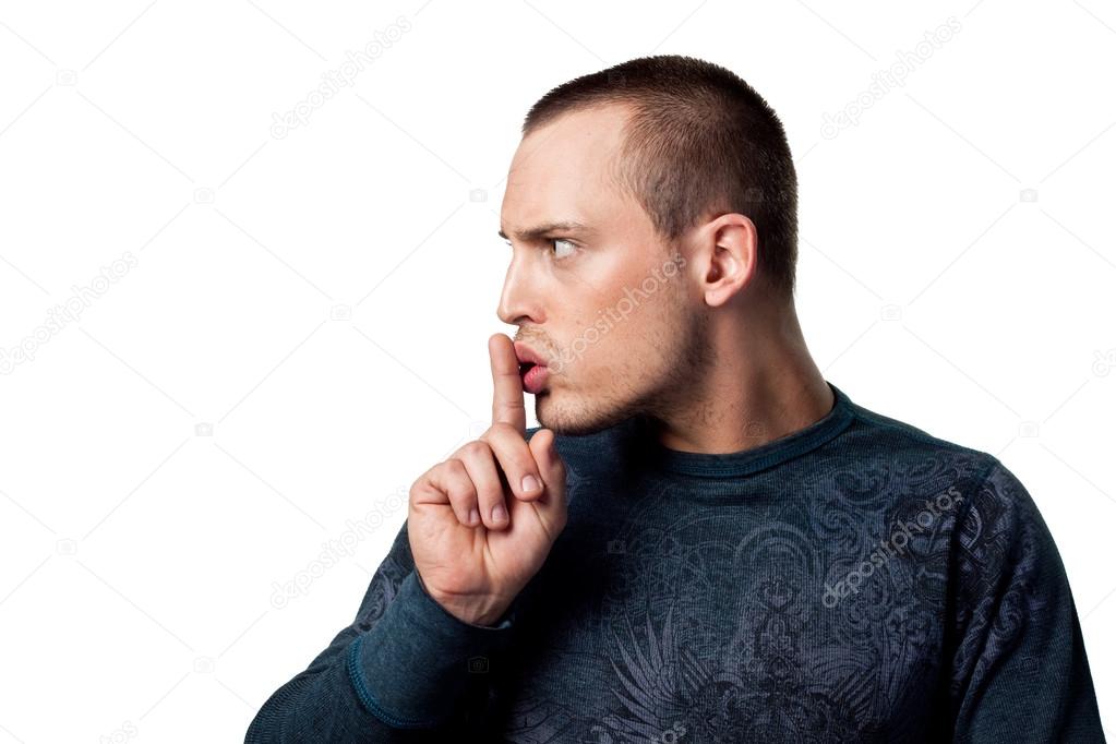 Man telling someone to be quiet