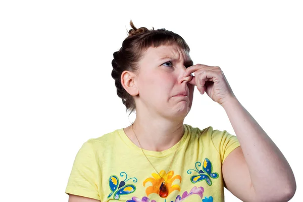 Woman pinches her nose — Stock Photo, Image