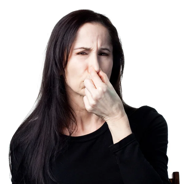 Woman covers her nose — Stock Photo, Image